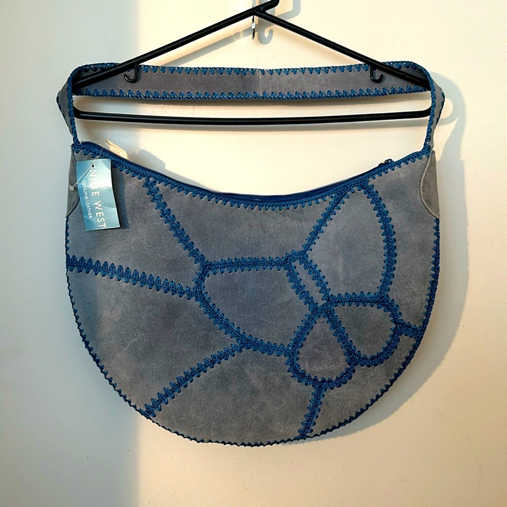 Nine West Denim color “Flutter” purse. New with tags. Never worn.